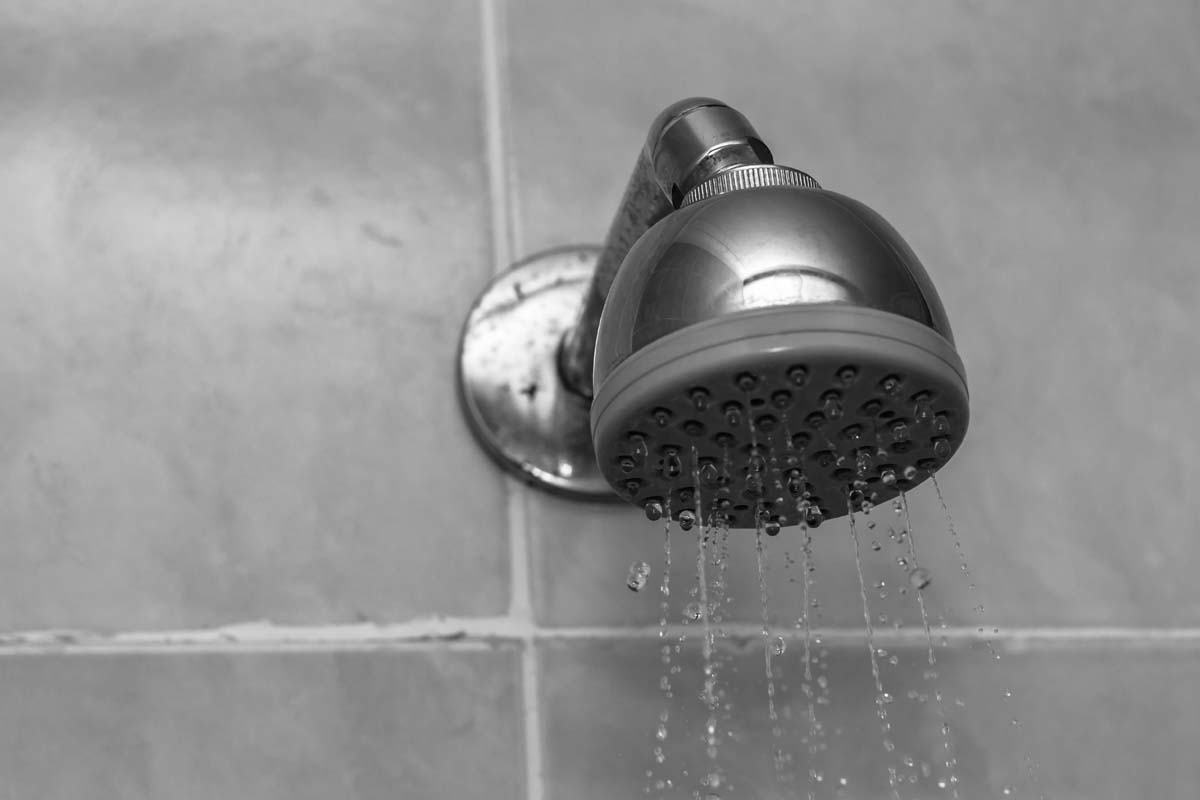 Cleaning a chrome shower head to restore water flow
