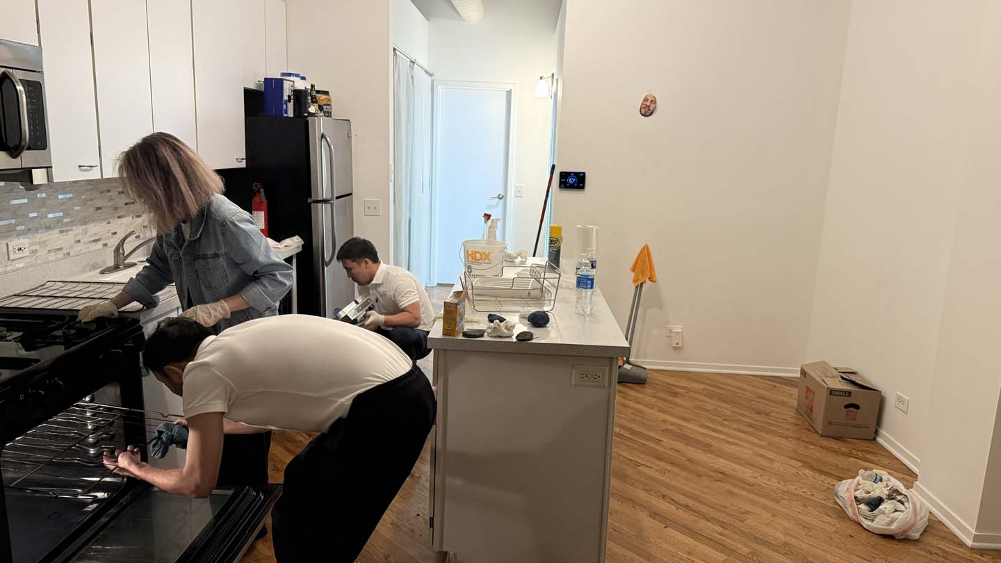 Home cleaner tidying a Chicago apartment